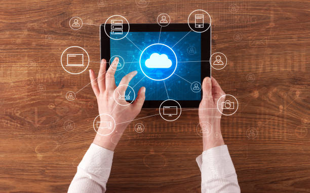 Hand using tablet with centralized cloud computing system concept stock photo