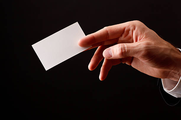 Hand with Blank Business Card stock photo