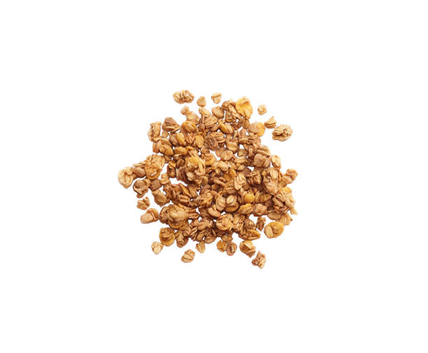 Handful of granola oatmeal isolated on white background, top view. stock photo
