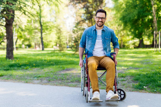 handicapped man - wheelchair street imagens e fotografias de stock