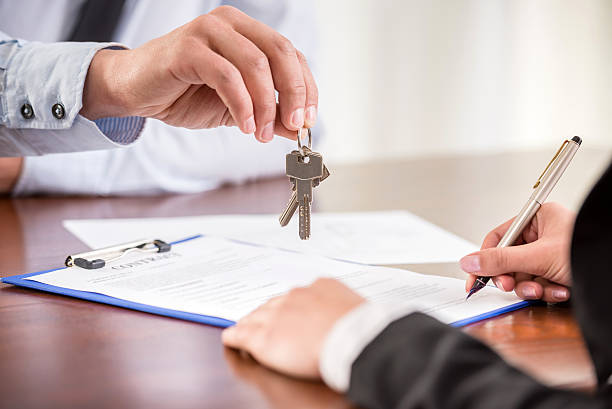 Handing over keys when signing contract stock photo