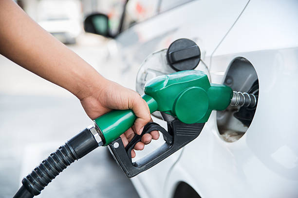 Handle fuel nozzle to refuel the car. stock photo