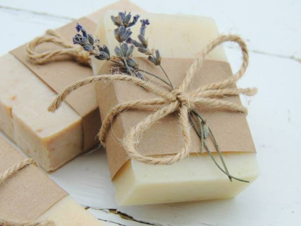 Handmade spa bath soap on vintage wooden background. Handmade spa lavender soap on vintage wooden background. Soap making. Soap bars. Spa, skin care. Gift wrapping. homemade stock pictures, royalty-free photos & images