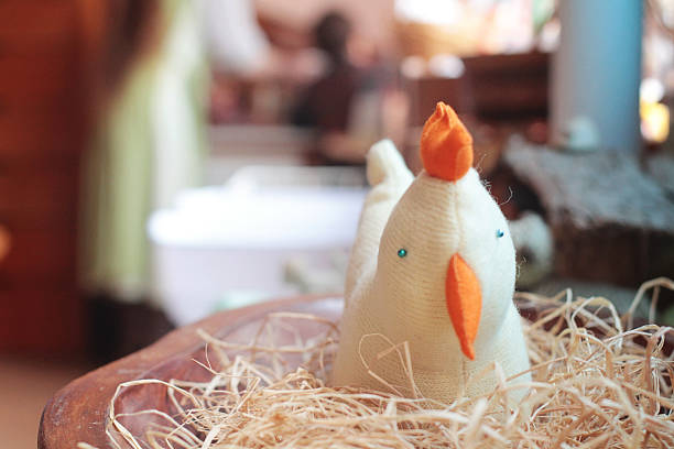 Handmade toy chicken in nest stock photo