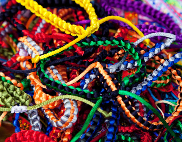 Handmade woven bracelets background stock photo