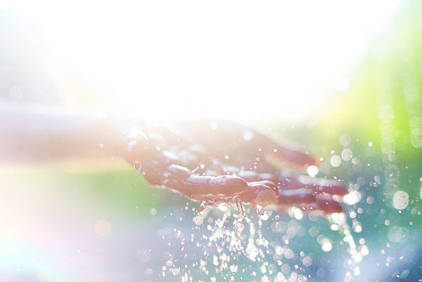 hands and water - rain woman sun stockfoto's en -beelden