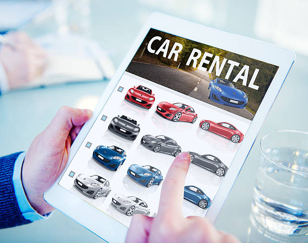 Hands Holding Digital Tablet Car Rental  car rental stock pictures, royalty-free photos & images