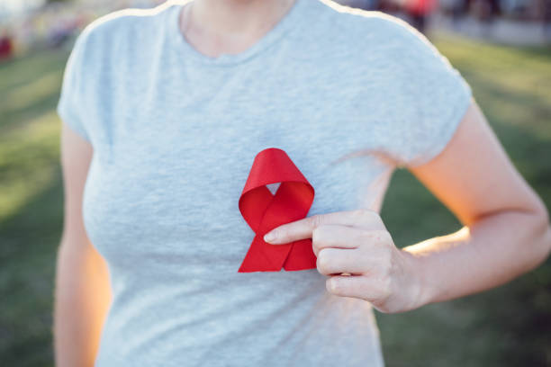 hands-holding-red-aids-awareness-ribbon-picture-