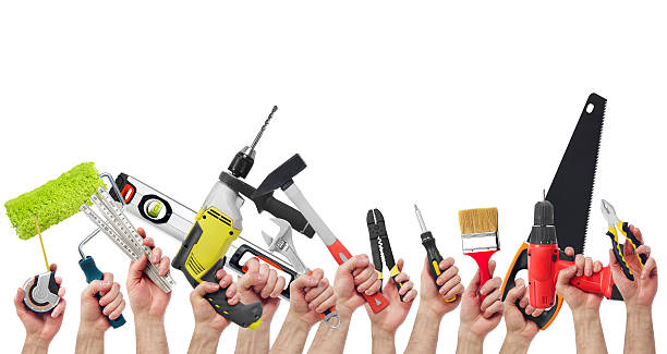 Hands holding tools stock photo