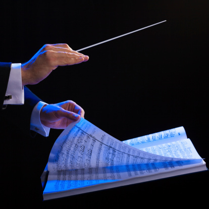 Conductor's hands with a baton