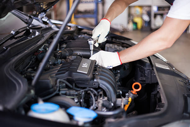 Hands of car mechanic Hands of car mechanic in auto repair service. engine stock pictures, royalty-free photos & images