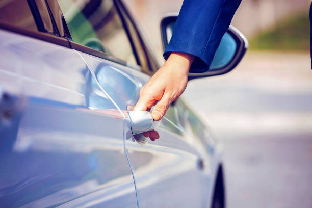 Hands of male driver opening the door Hands of male driver opening the door open car door stock pictures, royalty-free photos & images