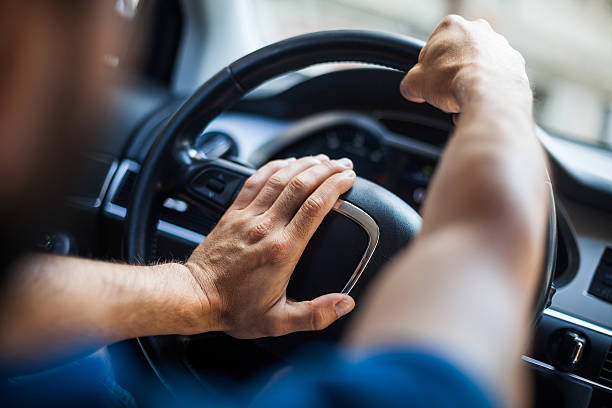 Hands on steering wheel, honking stock photo