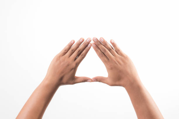 Hands showing the triangle sign stock photo