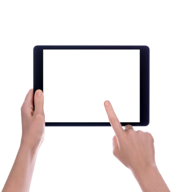 Hands touching black tablet screen stock photo