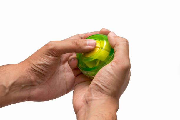 Hands Using Gyroscopic Ball For Exercise stock photo