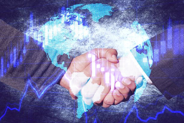 A handshake, the economy and the world stock photo