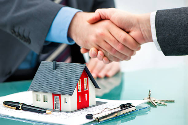 Handshakes with customer after contract signature stock photo