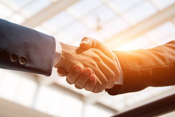 handshaking business people handshaking agreement stock pictures, royalty-free photos & images