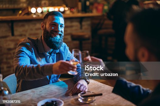 istock Handsome bearded men drinking whiskey 1192087315