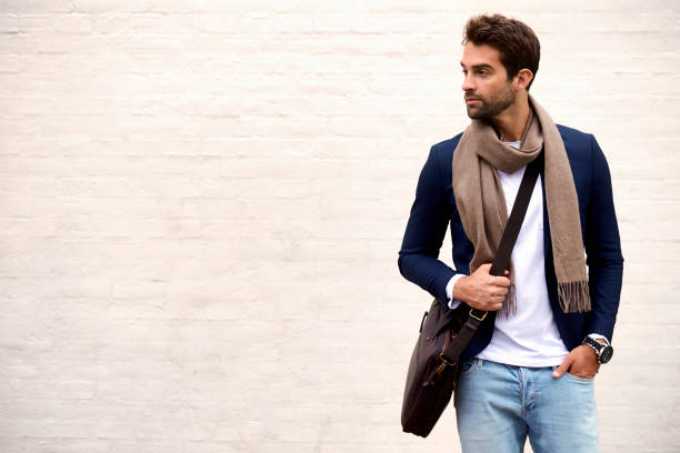 Handsome dude Handsome dude in scarf and jacket, looking away men bags stock pictures, royalty-free photos & images