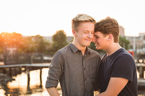Handsome Gay Couple Shares an Intimate Moment stock photo