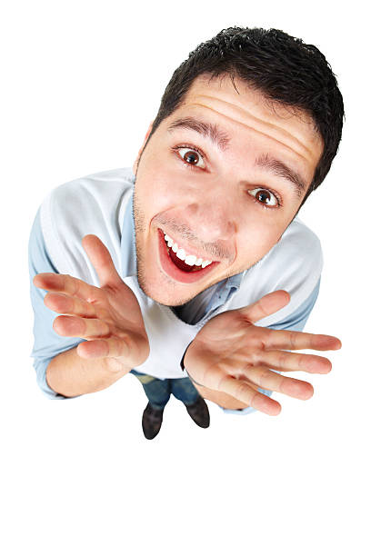 Handsome male making funny face into camera Happy nerdy looking male gesturing with his hands isolated on white backgroundYOU ARE WELCOME TO VISIT SOME OF MY MANAGED LIGHTBOXES fish eye lens stock pictures, royalty-free photos & images