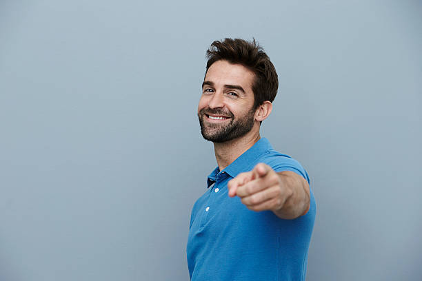 Handsome man pointing stock photo