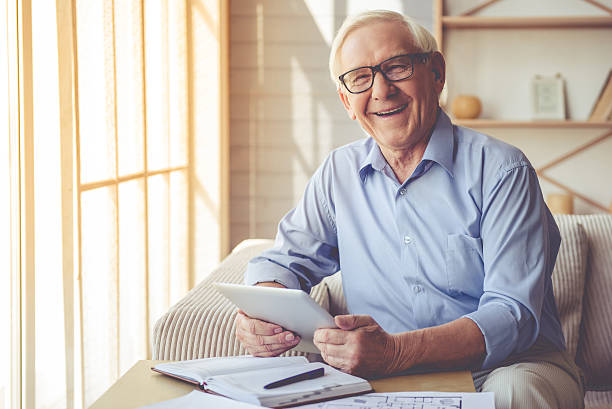Handsome old man at home stock photo