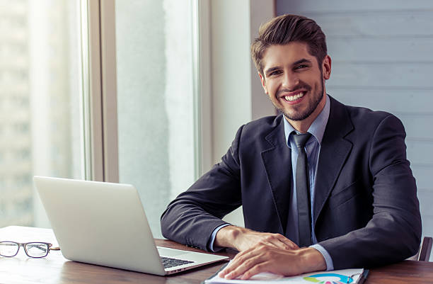 Handsome young businessman working stock photo