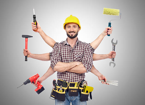 Handyman with tools Cheerful carpenter looking at camera with tolls in six hands tool belt stock pictures, royalty-free photos & images
