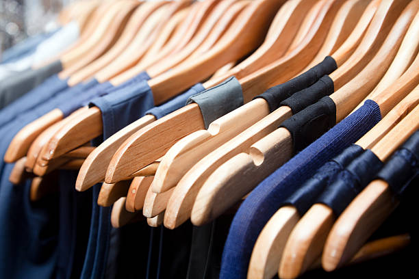 Hangers, blue dresses Close up of hangers row.Shoping Lightbox clothes rack stock pictures, royalty-free photos & images