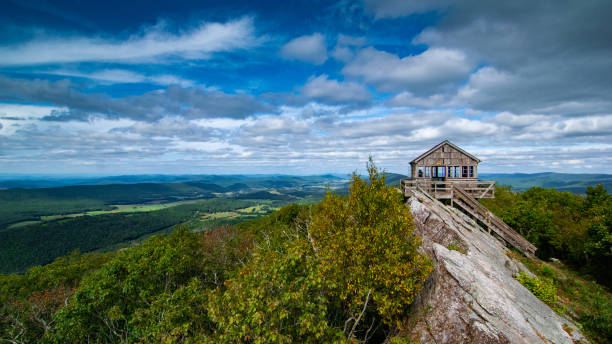 Hanging Rock Raptor Observatory This is the Hanging Rock Raptor Observatory is a fire look out tower that was converted into a public building where you can visit and watch migratory predatory birds fly by fire lookout tower stock pictures, royalty-free photos & images