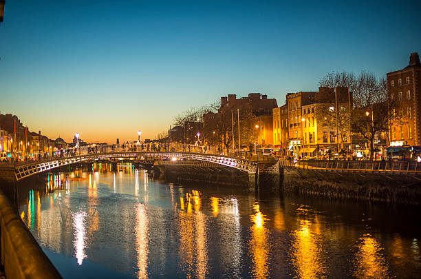 Ha'penny Bridge Dublin at dusk over the river Liffey, Dublin, Ireland. stock photo