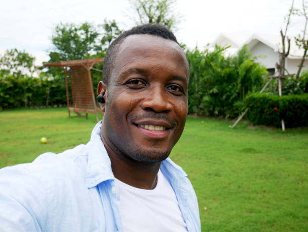 Happiness Africa young smile portrait and selfie at garden park. stock photo
