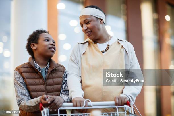 Happy African American Family Shopping in Supermarket