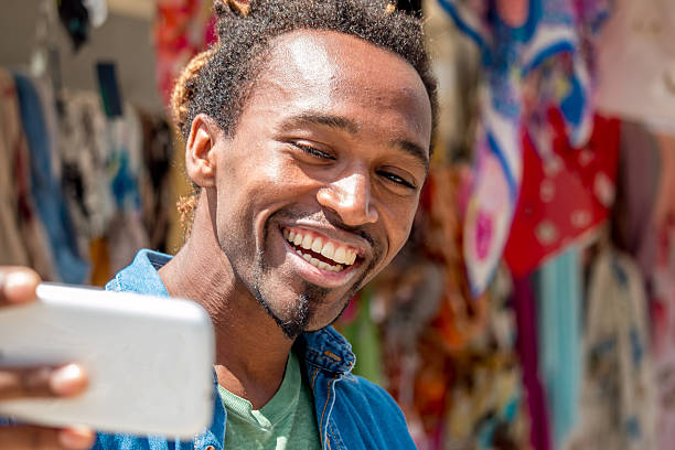 happy african american guy with bright teeth smiling stock photo