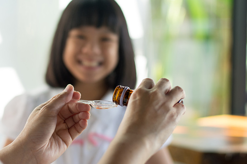 ✓ girl taking medicine Stock Photos