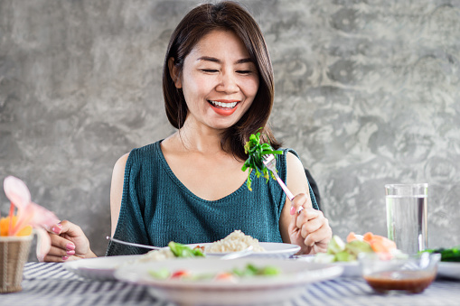 Happy Asian Woman Eating Healthy Food And Green Vegetables Stock Photo -  Download Image Now - iStock