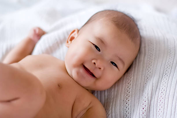 Happy baby, laughing and looking away from camera  philippines girl stock pictures, royalty-free photos & images