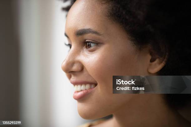 Happy beautiful young African American woman face portrait