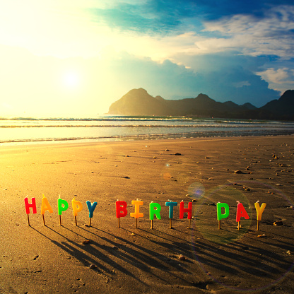 Happy Birthday Colorful Candles On A Beach Sunrise Stock Photo - Download Image Now - iStock