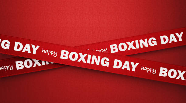 Happy Boxing Day written red ribbons over red background. Horizontal composition with copy space. Boxing Day concept.