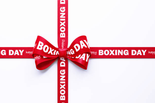 Happy Boxing Day written red Tied Bow over white background. Horizontal composition with clipping path and copy space. Boxing Day concept.