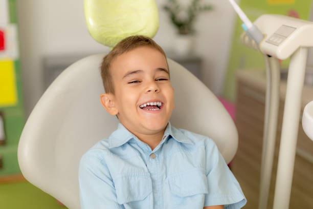 Happy boy at the dental office stock photo