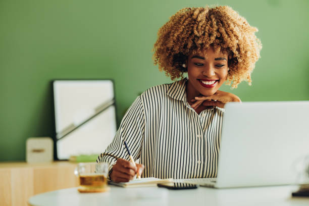 Happy Businesswoman Working at her Office stock photo