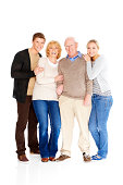 Portrait of a happy Caucasian family standing together isolated on white background