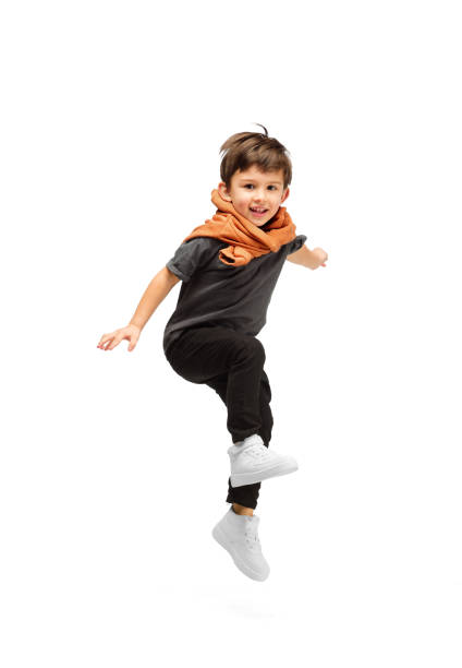 Happy caucasian little boy isolated on white studio background. Looks happy, cheerful, sincere. Copyspace. Childhood, education, emotions concept Jumping, running. Happy, smiley little caucasian boy isolated on white studio background with copyspace for ad. Looks happy, cheerful. Childhood, education, human emotions, facial expression concept. boy jumping stock pictures, royalty-free photos & images