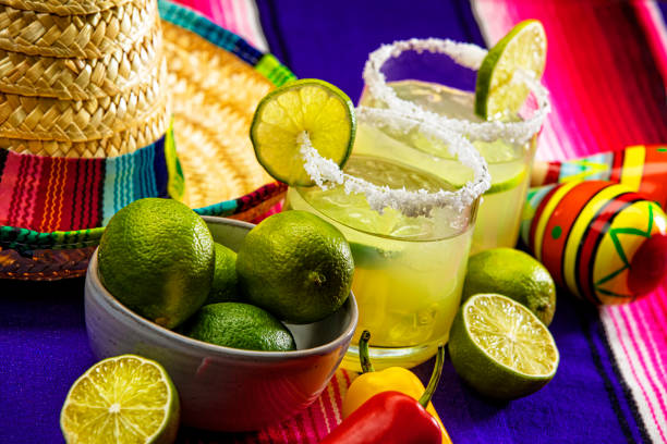 Happy Cinco de Mayo with two Margarita Glasses on a Colorful Mexican Blanket stock photo