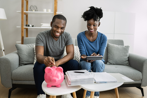 Happy African Couple Doing Retire Finances Plan And Money Budget